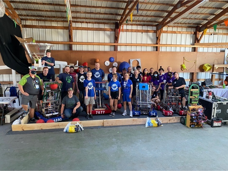 large group photo with robots  