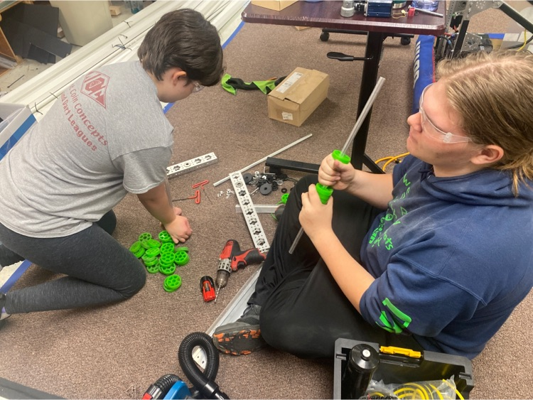 kids taking apart intake of robot  
